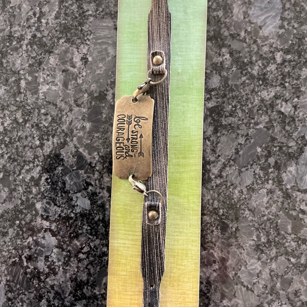 Leather and Metal “Be Strong and Courageous” Bracelet.
9.25 length.